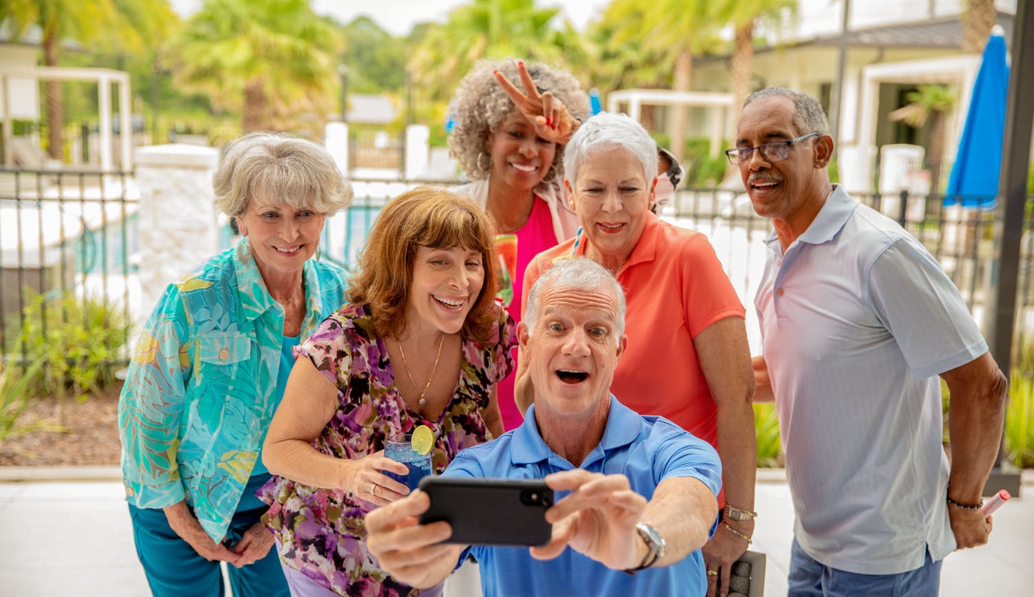 arbor terrace residents taking selfie at Patio Party