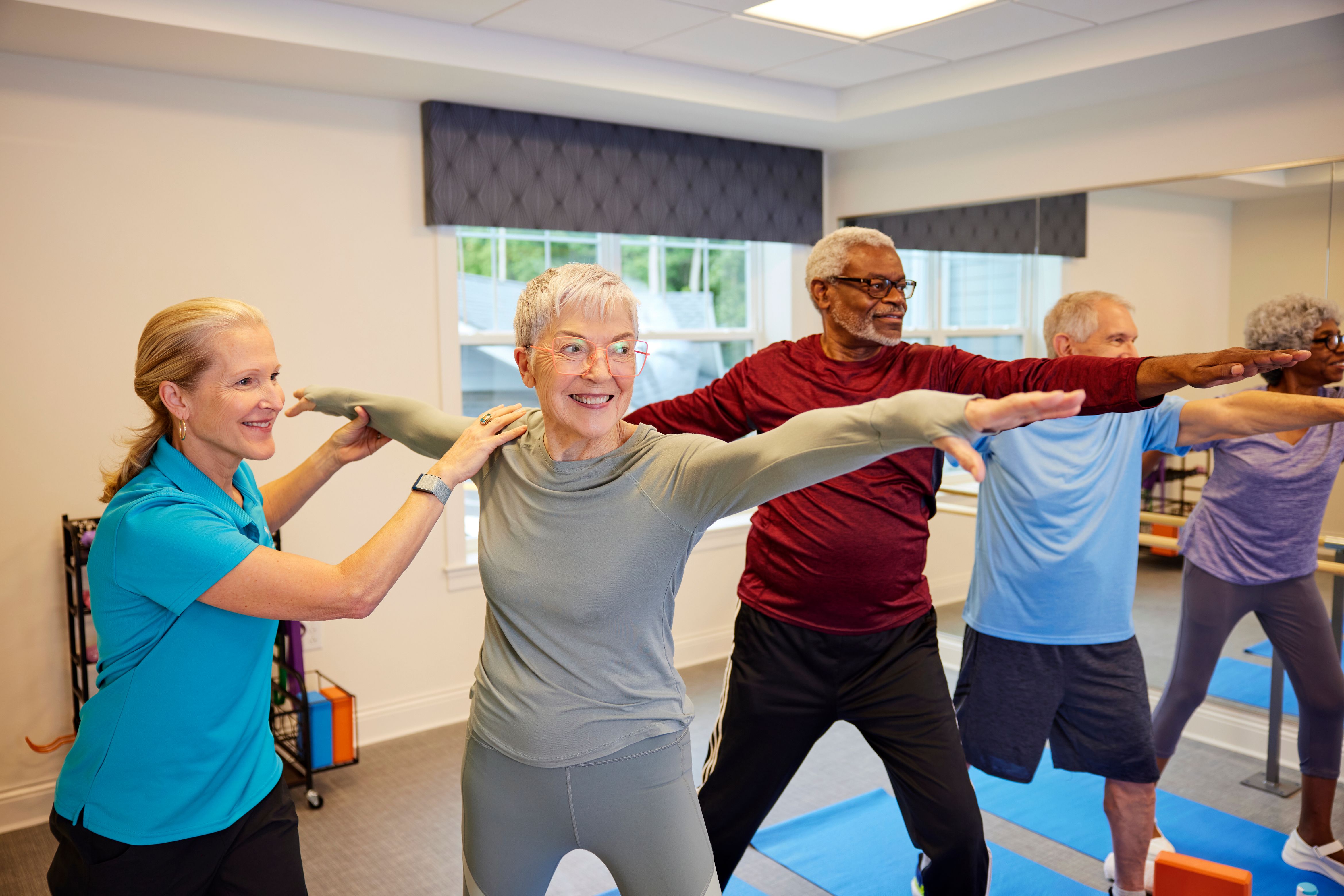 arbor terrace residents going yoga in fitness class