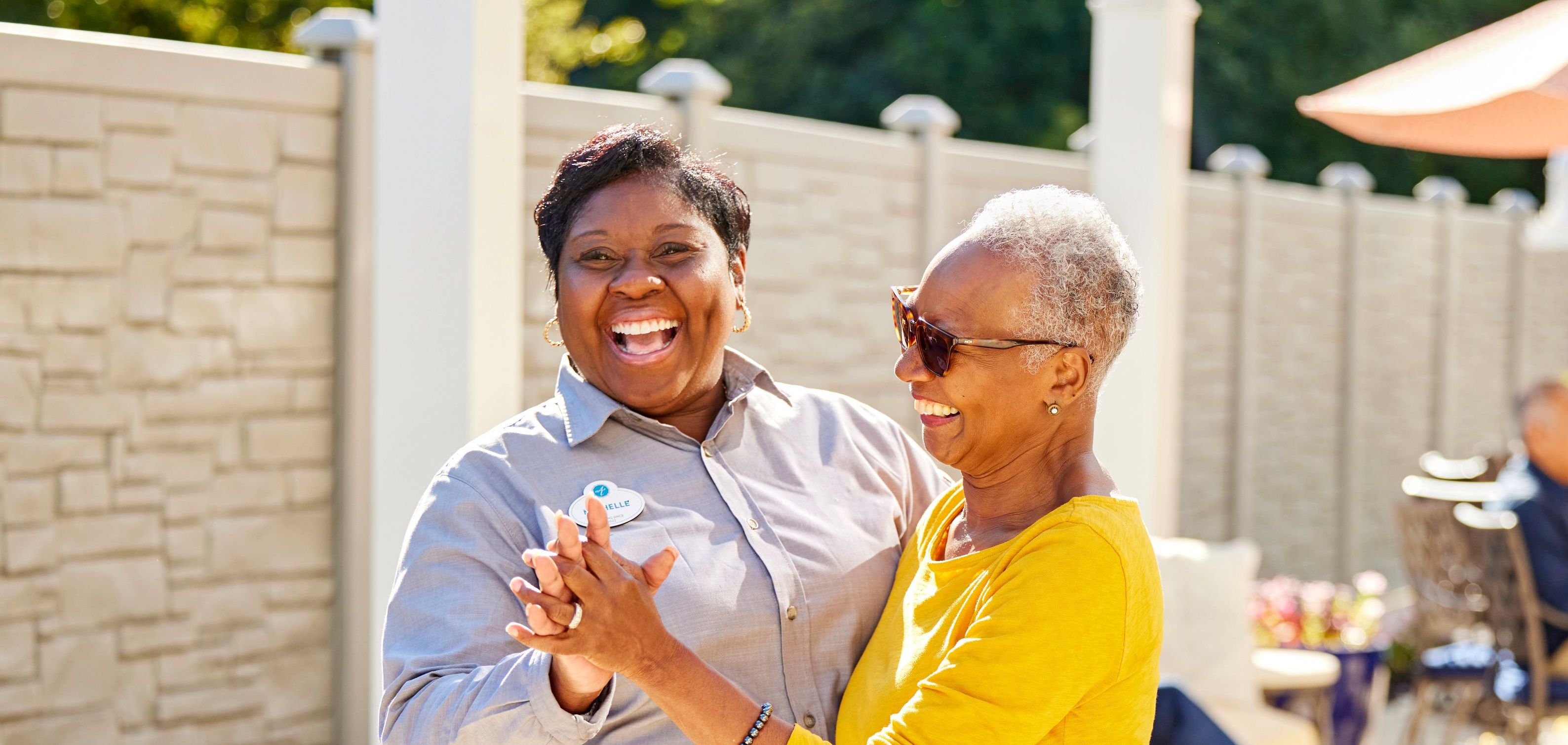 arbor terrace resident and staff dancing